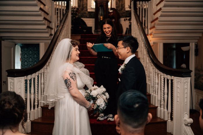 bride in vintage wedding dress during ceremony