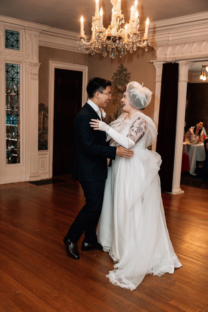 bride dancing in vintage wedding dress