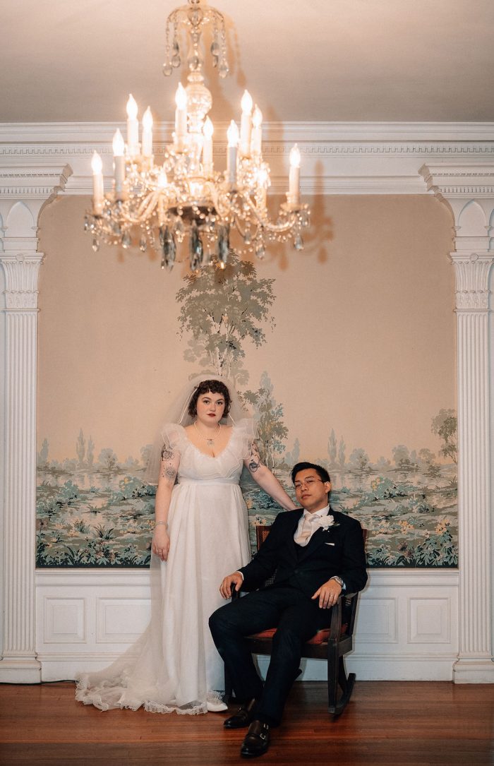 bride wears vintage wedding dress at wedding in Foss Mansion